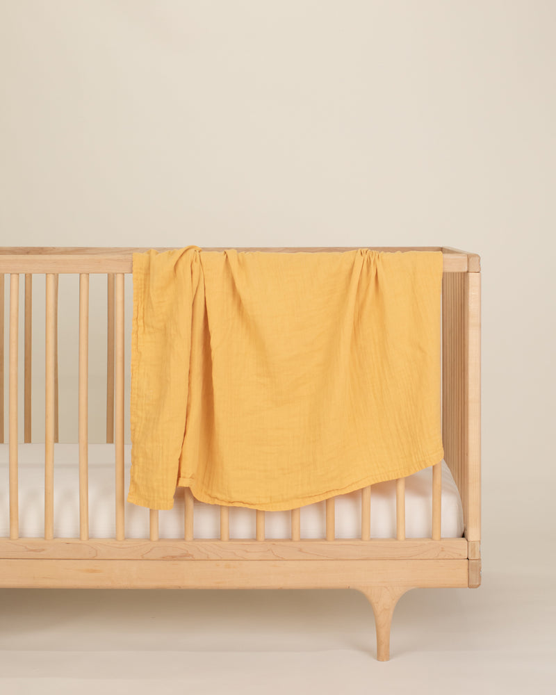 gold organic cotton gauze swaddle