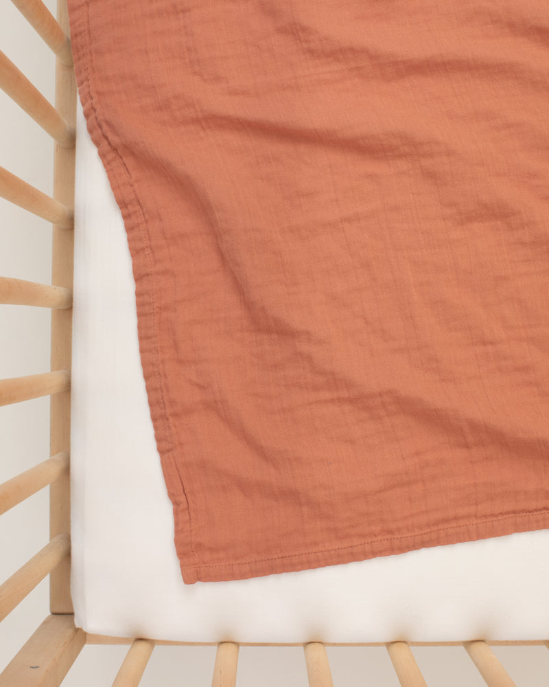 rust organic cotton gauze swaddle