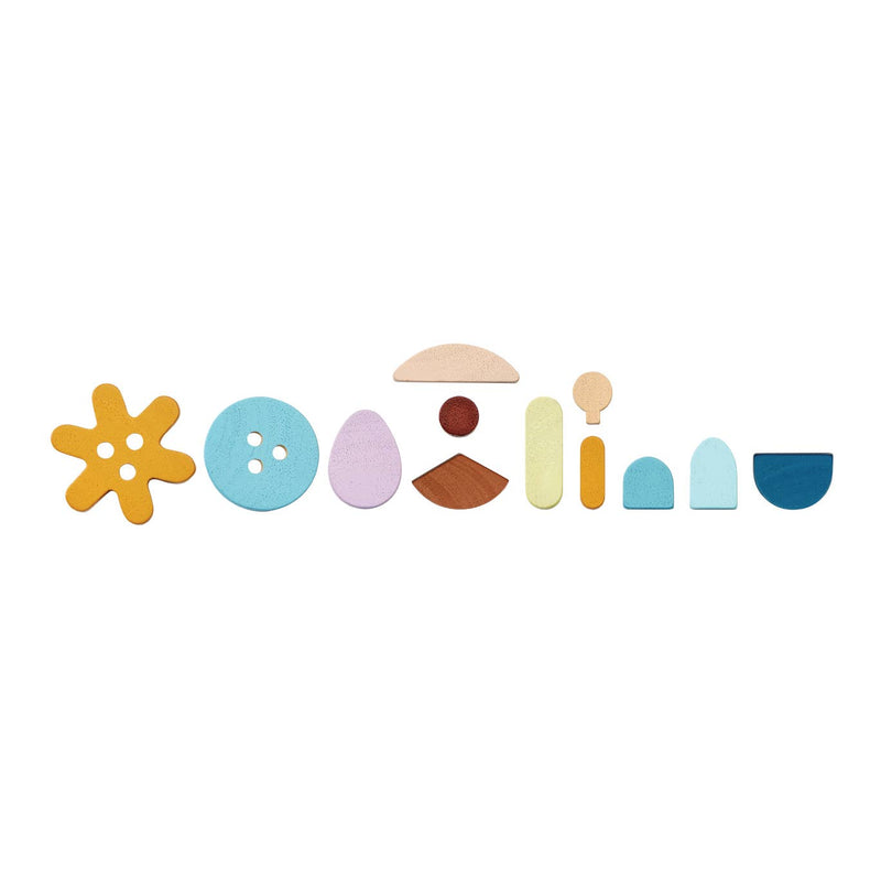 Colorful wooden letters spelling 'Ooh La La' on a white background