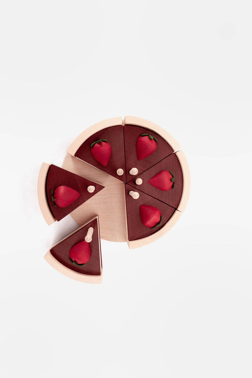 Chocolate pizza with red heart-shaped candies on a light gray background