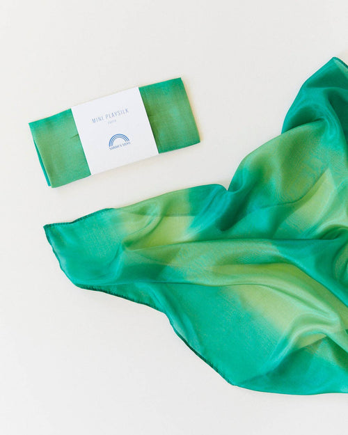 Green scarf with a brand label on a white background