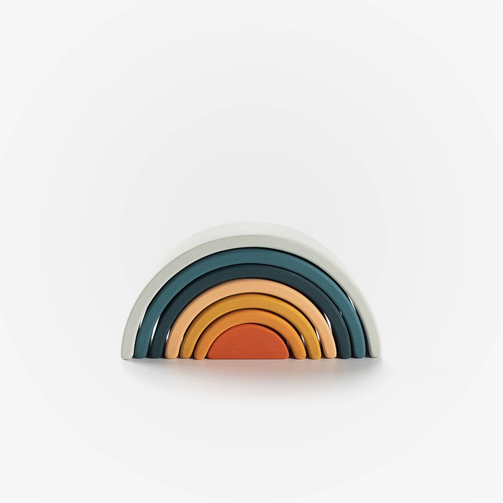 Decorative shelf with rainbow pattern on a white background