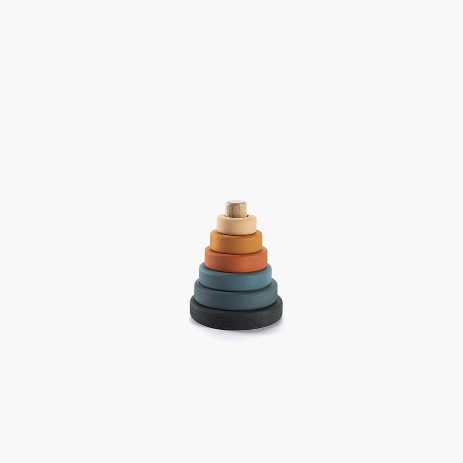 Stack of colorful wooden rings on a white background