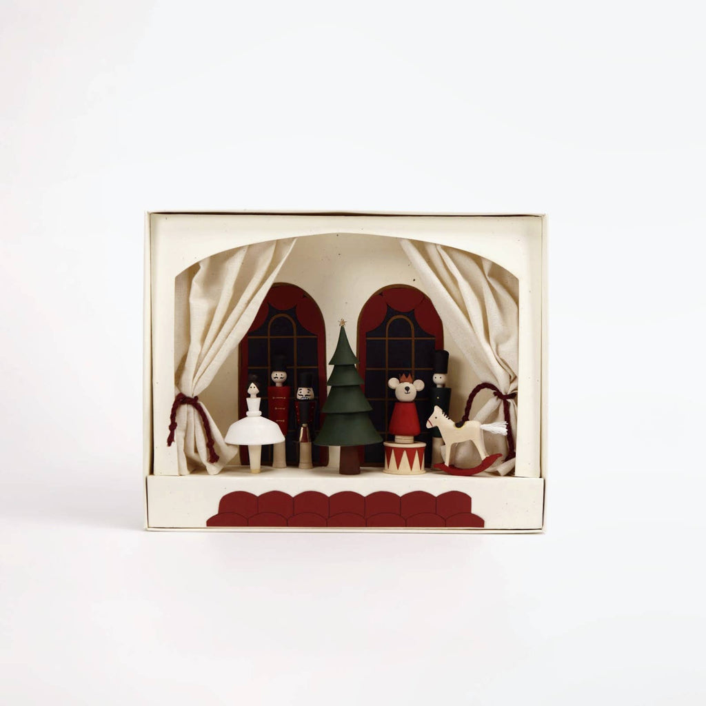 Decorative box with a miniature Christmas scene on a white background