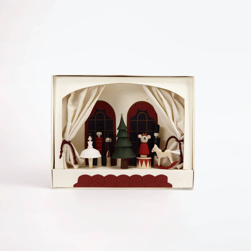 Decorative box with a miniature Christmas scene on a white background