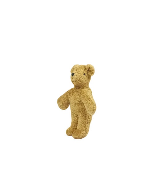 Brown teddy bear on a white background