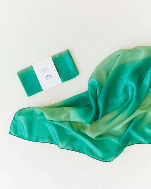 Green satin scarf with a box on a white background