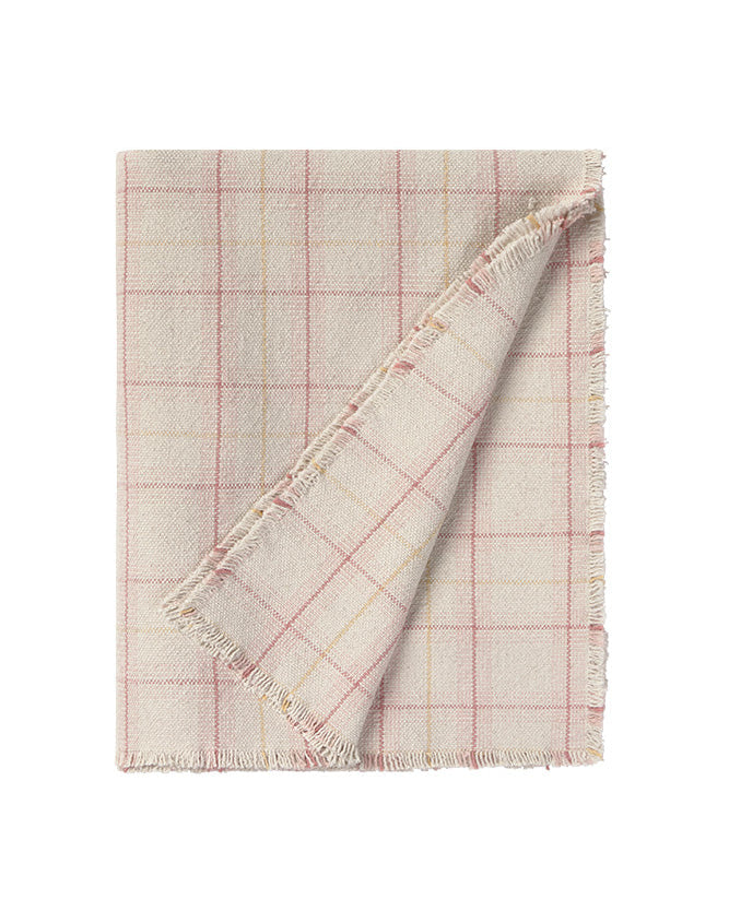 Plaid blanket with pink and beige colors on a white background