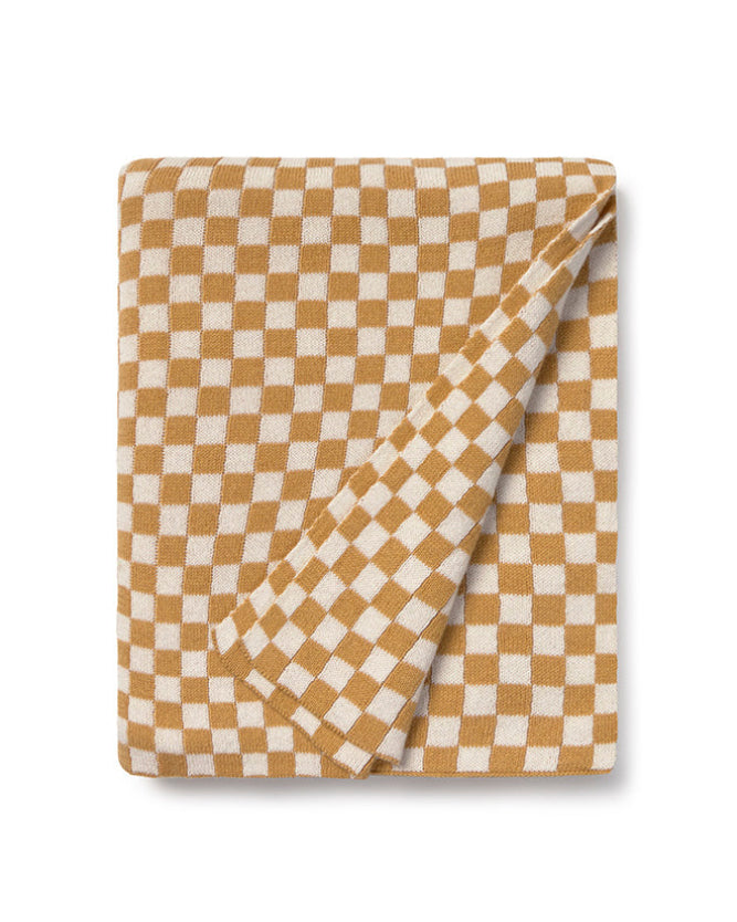 Checkered blanket with brown and white pattern on a white background
