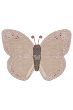 Butterfly-shaped decorative item with a textured surface on a white background