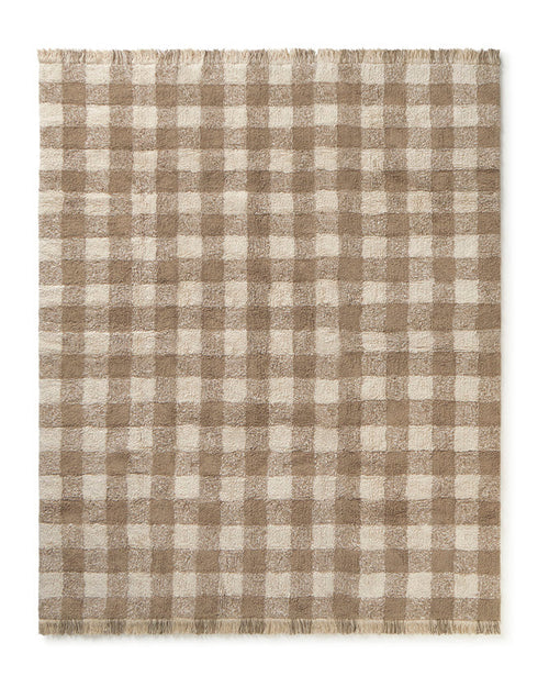 Checkered rug with brown and beige pattern on a white background