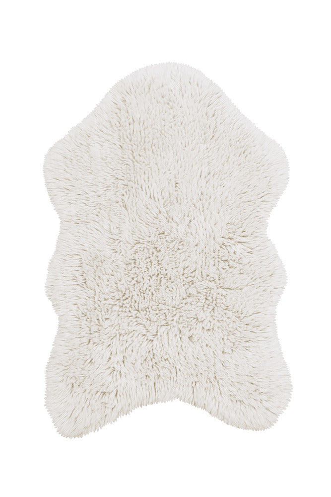 White fluffy sheep rug on a white background