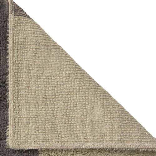 Textured green carpet corner on a white background