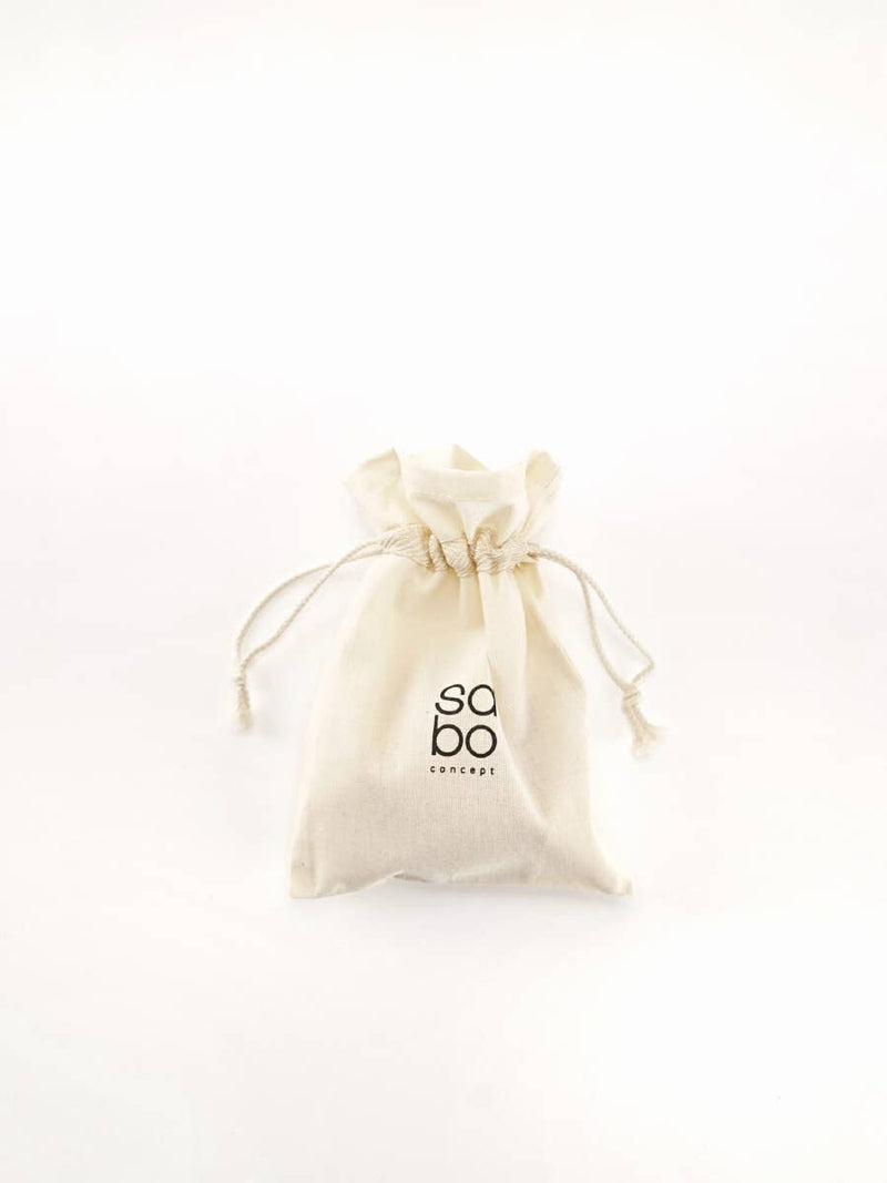 Beige drawstring bag with 'sabo' branding on a white background