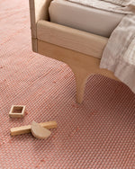 hand-loomed rug / root