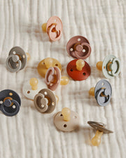 Multi color natural rubber bibs pacifier on organic gauze